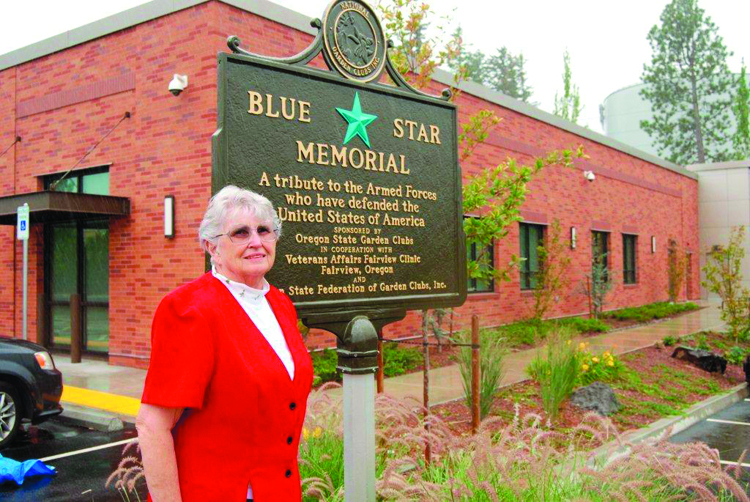 Kathryn Israelson with Fairview memorial plaque